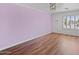 Spacious bedroom with light purple walls and wood floors at 580 N Benson Ln, Chandler, AZ 85224