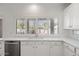 Kitchen with white cabinets and quartz countertops at 580 N Benson Ln, Chandler, AZ 85224