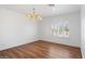 Bright dining room with wood floors and chandelier at 580 N Benson Ln, Chandler, AZ 85224