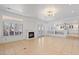 Spacious living room with fireplace and access to backyard at 580 N Benson Ln, Chandler, AZ 85224