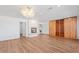 Main bedroom featuring hardwood floors, a fireplace, and ample closet space at 580 N Benson Ln, Chandler, AZ 85224
