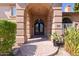 Elegant entryway with ornate double doors and brick walkway at 580 N Benson Ln, Chandler, AZ 85224