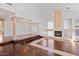 Open living area with hardwood floors and a fireplace at 580 N Benson Ln, Chandler, AZ 85224
