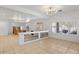 Open living room with a fireplace, high ceilings and wood flooring at 580 N Benson Ln, Chandler, AZ 85224