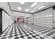 Large garage with checkerboard floor and ample storage at 580 N Benson Ln, Chandler, AZ 85224