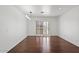 Bright living room with hardwood floors and sliding glass doors leading to a patio at 580 N Benson Ln, Chandler, AZ 85224