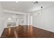 Spacious living area with hardwood floors, a modern light fixture, and a loft view at 580 N Benson Ln, Chandler, AZ 85224