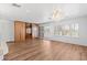 Large main bedroom with hardwood floors, built-in wardrobes, and access to a balcony at 580 N Benson Ln, Chandler, AZ 85224