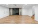 Bright bedroom featuring hardwood floors and built-in wardrobes at 580 N Benson Ln, Chandler, AZ 85224