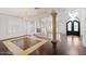Spacious living room featuring hardwood floors and a fireplace at 580 N Benson Ln, Chandler, AZ 85224