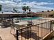 Community pool with tables and chairs at 805 Cinnabar Dr, Apache Junction, AZ 85119