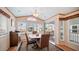 Bright dining area with wood table and chairs, and access to patio at 805 Cinnabar Dr, Apache Junction, AZ 85119