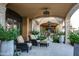 Serene covered patio with comfortable seating and lush greenery at 11179 E Honda Bow Rd, Scottsdale, AZ 85262
