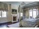 Main bedroom with fireplace, sitting area, and large windows at 11179 E Honda Bow Rd, Scottsdale, AZ 85262