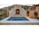 Relaxing hot tub with stone surround and mountain views at 11179 E Honda Bow Rd, Scottsdale, AZ 85262