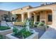 Elegant courtyard with fountain, landscaping, and seating area at 11179 E Honda Bow Rd, Scottsdale, AZ 85262