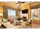 Cozy living room with fireplace and mountain views at 11179 E Honda Bow Rd, Scottsdale, AZ 85262