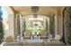 Relaxing covered patio with comfortable seating and arched entryways at 11179 E Honda Bow Rd, Scottsdale, AZ 85262