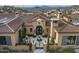 Luxury estate home with tiled roof and stunning mountain backdrop at 11179 E Honda Bow Rd, Scottsdale, AZ 85262