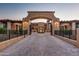 Impressive gated entry to a luxurious estate with a grand courtyard at 11179 E Honda Bow Rd, Scottsdale, AZ 85262
