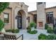 Charming courtyard with fireplace, seating area, and lush greenery at 11179 E Honda Bow Rd, Scottsdale, AZ 85262