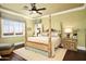 Main bedroom with a four poster bed and mountain views at 11179 E Honda Bow Rd, Scottsdale, AZ 85262