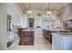 Large kitchen with island, custom cabinetry, and high-end appliances at 11179 E Honda Bow Rd, Scottsdale, AZ 85262