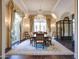 Formal dining room with a large table, chandelier, and access to a patio at 11179 E Honda Bow Rd, Scottsdale, AZ 85262