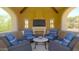Covered patio with fireplace and comfortable seating, perfect for outdoor gatherings at 11179 E Honda Bow Rd, Scottsdale, AZ 85262