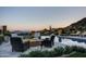 Relaxing poolside patio with fire pit and stunning mountain views at 11179 E Honda Bow Rd, Scottsdale, AZ 85262