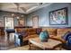 Game room with sectional sofa, billiard table, and large artwork at 11179 E Honda Bow Rd, Scottsdale, AZ 85262