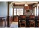 Wet bar with granite countertop and custom cabinetry at 11179 E Honda Bow Rd, Scottsdale, AZ 85262