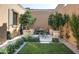 Secluded garden with a small table and lush greenery at 11179 E Honda Bow Rd, Scottsdale, AZ 85262