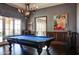 Game room with billiard table and access to outdoor patio at 11179 E Honda Bow Rd, Scottsdale, AZ 85262