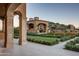 Landscaped backyard with outdoor kitchen and pergola at 11179 E Honda Bow Rd, Scottsdale, AZ 85262