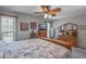 Main bedroom with wooden bed frame and dresser at 12620 W Parkwood Dr, Sun City West, AZ 85375