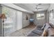 Gathering room with tiled floor, sliding door, and gray sofa at 12620 W Parkwood Dr, Sun City West, AZ 85375
