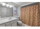 Clean bathroom with shower/tub combo, toilet and vanity at 12620 W Parkwood Dr, Sun City West, AZ 85375