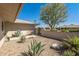 Landscaped front yard with gravel, agave plants, and a gated entryway at 12620 W Parkwood Dr, Sun City West, AZ 85375