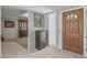 Bright entryway with tile flooring and wood door at 12620 W Parkwood Dr, Sun City West, AZ 85375