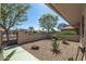 Neatly landscaped front yard with gravel, agave plants, and a metal gate at 12620 W Parkwood Dr, Sun City West, AZ 85375