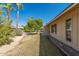 Backyard with grass, trees, and rock landscaping at 12620 W Parkwood Dr, Sun City West, AZ 85375
