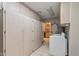 Laundry room with washer, dryer, cabinets and access to kitchen at 12620 W Parkwood Dr, Sun City West, AZ 85375