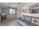 Bright living room features a comfy sofa and views into adjacent kitchen at 12620 W Parkwood Dr, Sun City West, AZ 85375