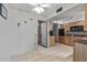 Kitchen features light wood cabinets and access to laundry at 12620 W Parkwood Dr, Sun City West, AZ 85375