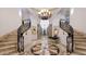 Grand entryway with a sweeping staircase and elegant chandelier at 5400 E Valle Vista Rd # 6, Phoenix, AZ 85018