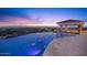 Infinity pool with fountains and city views at sunset at 5400 E Valle Vista Rd # 6, Phoenix, AZ 85018