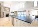 Large kitchen island with sink, dishwasher, and ample counter space at 5400 E Valle Vista Rd # 6, Phoenix, AZ 85018