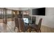 Dining area with glass table and striped chairs near the balcony at 5400 E Valle Vista Rd # 6, Phoenix, AZ 85018