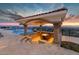 Covered patio with dining area overlooking stunning pool and city views at 5400 E Valle Vista Rd # 6, Phoenix, AZ 85018